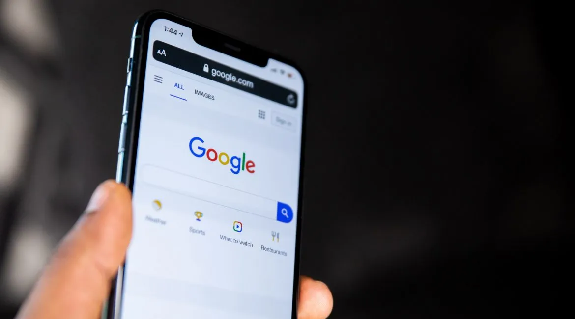 A smartphone with the Google website open.