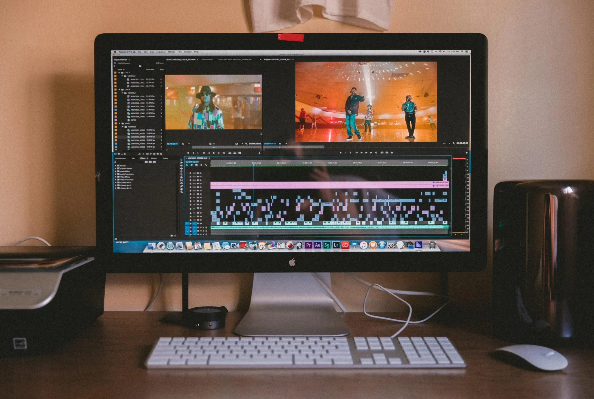 A computer on the desk with a video edition software open