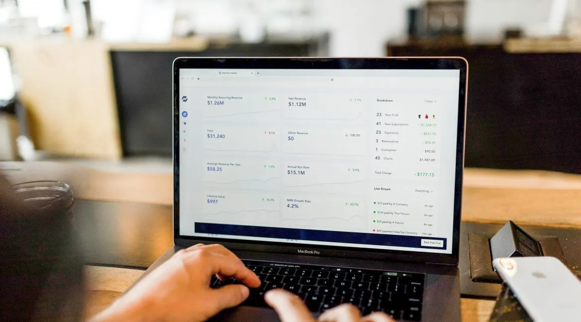 An open laptop presenting different metrics from Social Media.